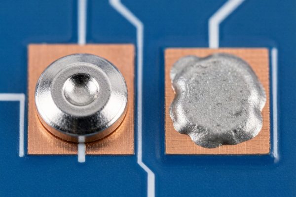 Solder preform disc and solder paste deposit on copper PCB pads side-by-side